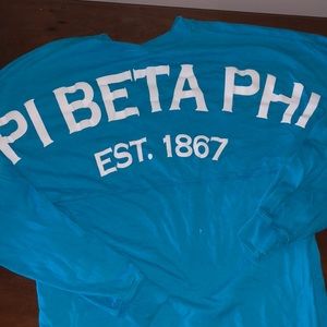 Pi Beta Phi long sleeve, blue spirit jersey with crest logo. XS
